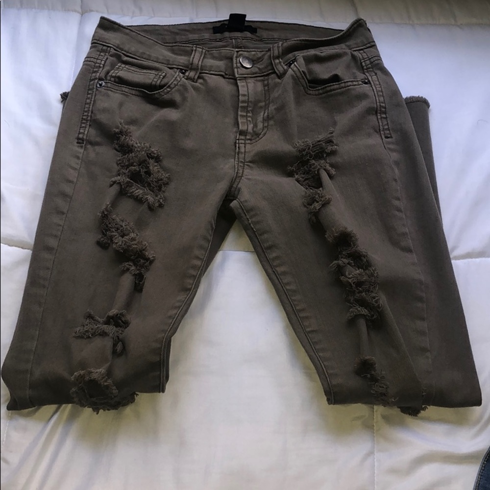 Green distressed jeans